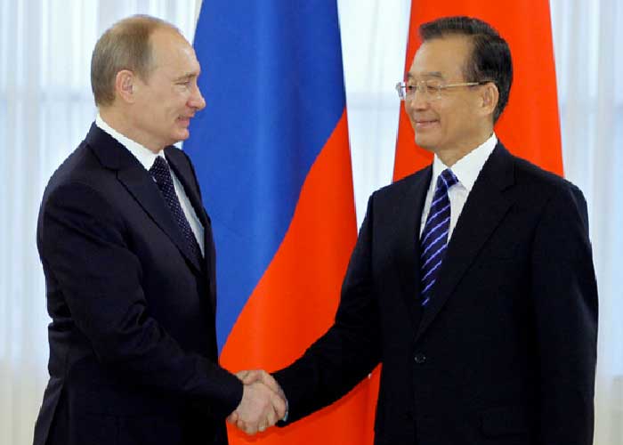 Premier Wen Jiabao shakes hands with Vladmir Putin on a visit to St. Petersburg. Alexey Druzhinin/AFP(Credit: http://www.chinadaily.com.cn/china/2010-11/24/content_11599087.htm)
