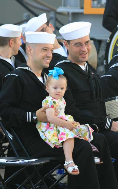 One of the younger participants at the LPD-24 christening does not know that her generation has the privilege of inheriting 70-year-old ships for the defense of her nation. She gets to pay for the national debt and have capital ships older than her parents and perhaps even her grandparents.  Great deal for her. (Credit: SLD)