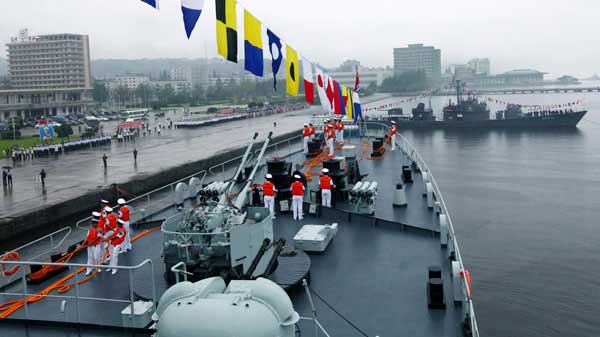 In this photo released by China's Xinhua News Agency, the Chinese Navy fleet composed of missile frigate Luoyang, front, and training ship Zheng He arrives in Wanson, North Korea, Thursday, Aug. 4, 2011. (Credit: http://www.ctv.ca/CTVNews/World/20110804/chinese-warships-north-korea-110804/)