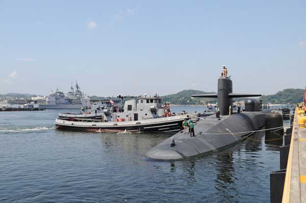 The guided-missile submarine USS Ohio arrives at Fleet Activities Yokosuka for a routine port visit. The visit to Yokosuka marks the beginning of a one-year deployment to U.S. 7th Fleet for Ohio. Ohio is home ported at Naval Base Kitsap, Bangor, Wash., and currently serves under Commander Submarine Group 7 at Fleet Activities Yokosuka, Japan. (Credit: USN Visual Service, 8/29/09)