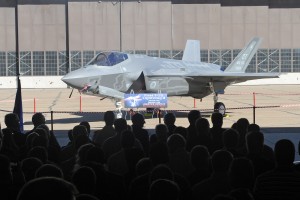 Dignitaries and employees at Hill Air Force Base, Utah, get their first look at the F-35A Lightning II Joint Strike Fighter Sept. 20, 2013. Hill, Lockheed Martin, Utah elected officials and community members gathered for a ceremony to commemorate the beginning of F-35 depot maintenance at the Ogden Air Logistics Complex. The F-35A is a multi-variant, multi-role, fifth generation fighter, and will undergo organic depot modification work at Hill AFB. (U.S. Air Force photo by Alex R. Lloyd/Released)