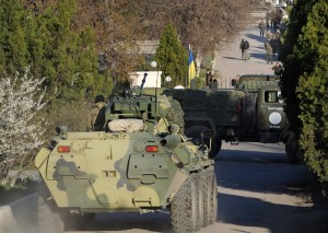 Russian tanks and soldiers storm a Ukrainian air force base in Belbek near the Crimean city of Sevastopol on March 22, 2014. (Viktor Drachev / AFP/Getty Images). 
