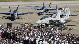 The U.S. Navy's premier fighter, the F-14 Tomcat was taken out of service during official ceremonies on Friday at Naval Air Station Oceana in Virginia Beach. It is replaced by the F/A-18, which is pictured in the background. (Adrin Snider) 