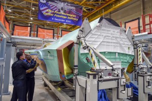 Technicians at Northrop Grumman's Palmdale (Calif.) Aircraft Integration Center of Excellence conduct final quality inspections on the center fuselage for AM-1, the first F-35 joint strike fighter produced for Norway. The unit, completed Dec. 9, will be mated with major structural components of the aircraft by F-35 prime contractor Lockheed Martin. 