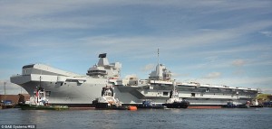 In July 2014 the warship was floated out of Rosyth Dock for the first time after it was filled with water. An estimated 10,000 people will have worked on her construction by the time it is complete Read more: http://www.dailymail.co.uk/news/article-2972278/Britain-s-new-aircraft-carrier-HMS-Queen-Elizabeth-sighted-River-Forth-6billion-fitting-Royal-Navy-s-biggest-ship-continues.html#ixzz3TEfIqOiT Follow us: @MailOnline on Twitter | DailyMail on Facebook 