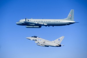 A RAF Typhoon accompanying a Russian Coot electronic intelligence gathering aircraft over the Baltic. RAF Typhoon jets deployed as part of the NATO Baltic Air Policing mission for Estonia, Latvia and Lithuania have found and identified two unknown aircraft on a mission over the Baltic Sea   The aircraft were scrambled from Ämari Air base in Estonia yesterday, to intercept aircraft approaching Baltic airspace without sharing a flight plan. The first aircraft was identified as a Il-20M ‘Coot’ A surveillance aircraft, which they shadowed for a period. The Typhoons were then re-tasked to check out a second unidentified aircraft, which was identified as an An-26 ‘Curl’ transport plane flying north from Kaliningrad.   The intercepts are the Typhoon’s fourth tasking since deploying to the Baltic in May.   Defence Secretary Michael Fallon, who plans to visit the Baltic Air Policing detachment later this month, said:   “The interception of Russian military aircraft by our RAF Typhoon fighters underlines our commitment to NATO and the security of the Baltic region. RAF air and ground crew are doing vital work to defend the skies above and around the Baltic States and I look forward to seeing that work first hand in the near future. “   Yesterday’s mission was enabled by close teamwork between the Estonian Air Force and the RAF Air Surveillance and Control System (ASACS) detachment at Ämari. ASACS detachment commander, Flight Lieutenant Paul “Griff” Griffin said:   “In this case the Typhoons were given the nod and the Estonian controllers hit the scramble button. The Estonian controllers picked up the aircraft on their radar picture and evaluated whether it had a flight plan and its heading, height and speed. Once it was clear it was an unknown they gave it an appropriate identification colour which made it stand out on our radar scopes. Once airborne it was my job to ensure a quick and efficient intercept, steering the Typhoons to 