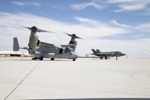 A U.S. Marine Corps MV-22B Osprey (left) descended on Edwards to link up with a Marine F-35B Joint Strike Fighter April 28. Both aircraft are assigned to Marine Operational Test & Evaluation Squadron 22 (VMX-22) out of Marine Corps Air Station Yuma in Arizona. The Osprey dropped by for a test to validate ground refueling from an MV-22 to an F-35B. (U.S. Air Force photo by Christian Turner) 