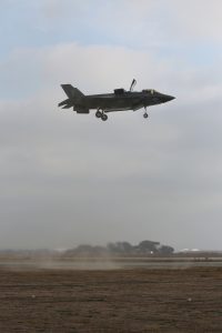 An F-35B Lightning II from Marine Fighter Attack Squadron 121 conducts a vertical landing on at a Forward Arming and Refueling Point (FARP) aboard Marine Corps Base, Camp Pendleton, Calif., Dec. 10, 2015. VMFA-121 marked another important milestone in the evolution of the aircraft conducting their first Close Air Support (CAS) missions in support of ground combat elements during exercise Steel Knight 16. (U.S. Marine Corps Combat Camera Photo by Chief Warrant Officer 2 Wade E. Spradlin/Released) 