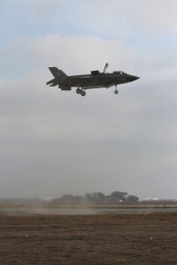 An F-35B Lightning II from Marine Fighter Attack Squadron 121 conducts a vertical landing on at a Forward Arming and Refueling Point (FARP) aboard Marine Corps Base, Camp Pendleton, Calif., Dec. 10, 2015. VMFA-121 marked another important milestone in the evolution of the aircraft conducting their first Close Air Support (CAS) missions in support of ground combat elements during exercise Steel Knight 16. (U.S. Marine Corps Combat Camera Photo by Chief Warrant Officer 2 Wade E. Spradlin/Released)